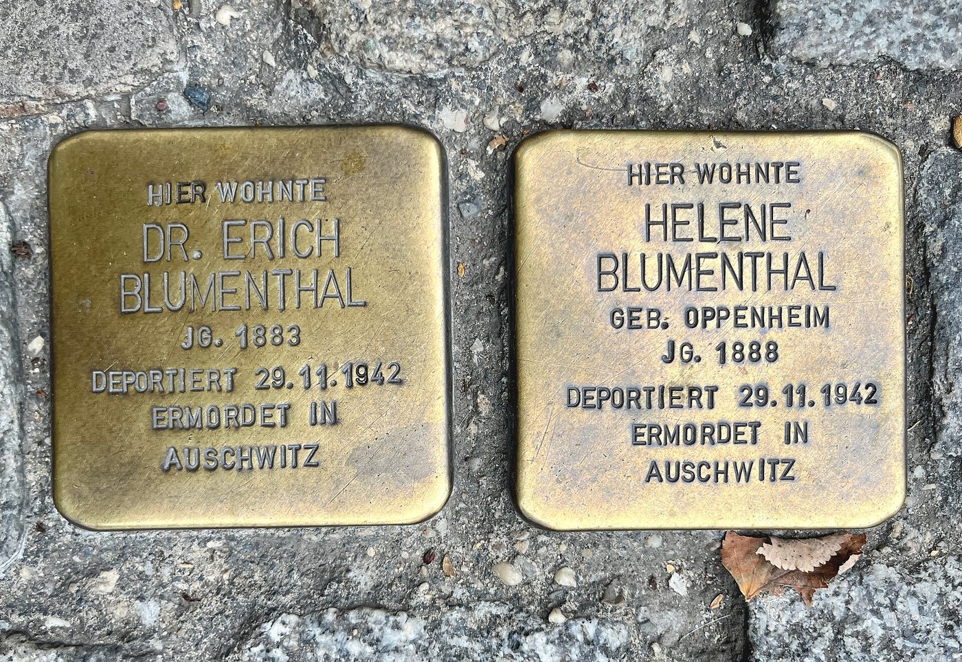 Stolpersteine (stumbling stones) set into a pavement in Berlin